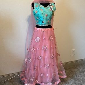 Beautiful ready to wear net lehenga with silk embroidered blouse.